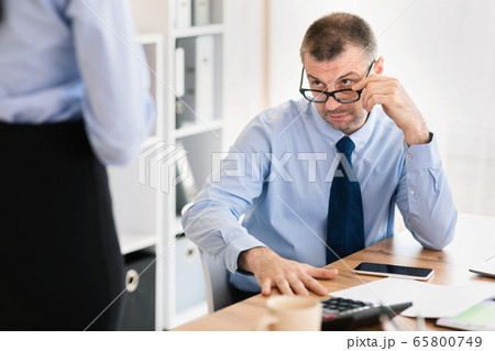 Mature Boss Seducing Young Employee Woman In Modern Office, Cropped Mature Boss Seducing Young Employee Woman In Modern Office, Cropped 65800749