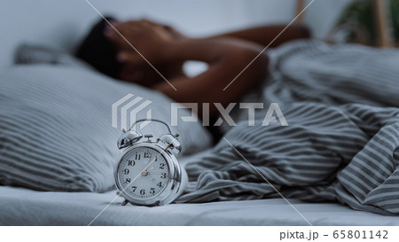 African american woman suffering from insomnia lying in bed without sleep. 65801142