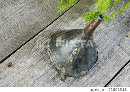 Antique brass funnel with handle on wooden 65801318