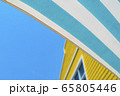 A green blue striped awning with yellow house and 65805446