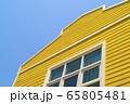 The yellow wooden house with mirror window and 65805481
