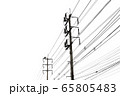 A technician climbing on electricity post to fix a 65805483