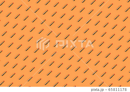 Red golden lipstick pattern on peach orange Red golden lipstick pattern on peach orange 65811178
