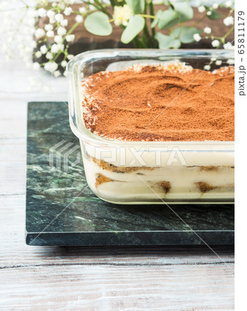 Traditional coffee tiramisu dessert in glass dish Traditional coffee tiramisu dessert in glass dish 65811179
