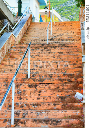 Old stone staircase with weathered shabby steps Old stone staircase with weathered shabby steps 65811801