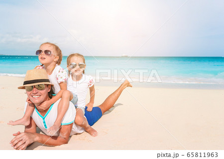 Happy beautiful family on a tropical beach vacation 65811963