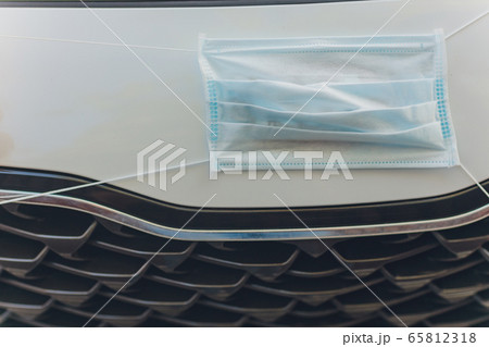 The medical mask in the car, virus concept. The medical mask in the car, virus concept. 65812318