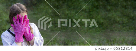 Girl covering her face with hands 65812814