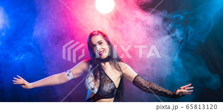 Close-up of woman in oriental costume performing belly dance. Tribal fusion dance concept. 65813120