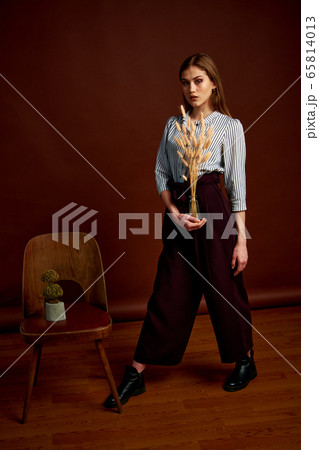 Gorgeous young female in classic suit, black shoes 65814013