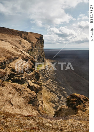 Icelandic landscape with cliffs and black sand Icelandic landscape with cliffs and black sand 65817327