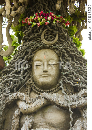 closeup of stoned shiv idol in abandon place in chail, icon of hindu god shiva used to perform puja or prayers closeup of stoned shiv idol in abandon place in chail, icon of hindu god shiva used to perform puja or prayers 65818529