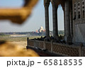 View of Taj Mahal from lattice jali in Agra, Uttar Pradesh, India. It was build by shah jahan as a memorial for his second wife Mumtaz Mahal 65818535