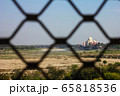 View of Taj Mahal from lattice jali in Agra, Uttar Pradesh, India. It was build in 1632 by Emperor Shah Jahan as a memorial for his second wife Mumtaz Mahal 65818536