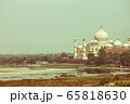 Cross processed vintage retro effect photo of Taj Mahal near yamuna river, Agra, India 65818630