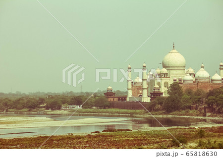 Cross processed vintage retro effect photo of Taj Mahal near yamuna river, Agra, India 65818630