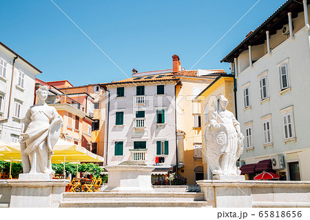 Old town Trg 1. maja square colorful buildings in Piran, Slovenia 65818656
