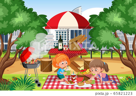 Scene with happy girls eating in the park 65821223
