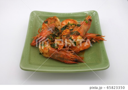 Fried shrimp with garlic on white background Fried shrimp with garlic on white background 65823350