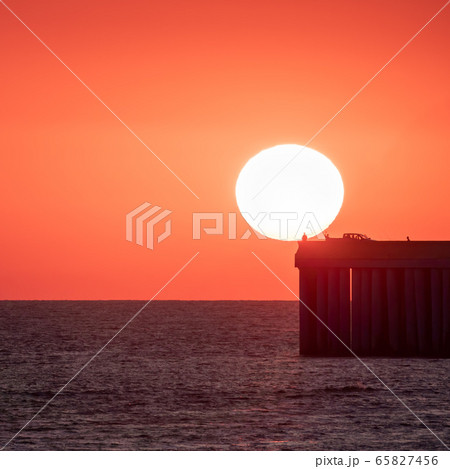 Beautiful red and orange sunset over the sea. Beautiful red and orange sunset over the sea. 65827456