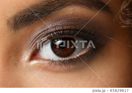 Eye of a black woman shot large macro 65829617