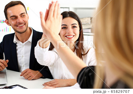 Group of joyful smiling happy people celebrate win Group of joyful smiling happy people celebrate win 65829707