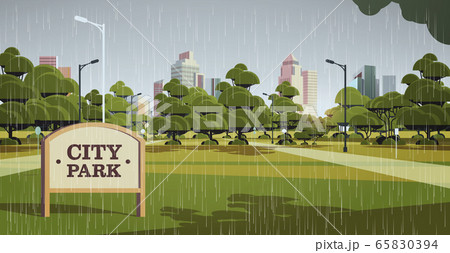 sign board in city park rain drops falling rainy summer day skyline skyskraper buildings cityscape 65830394