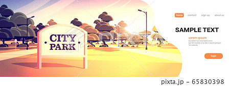 sign board in city park beautiful summer day skyline skyskraper buildings sunset cityscape 65830398