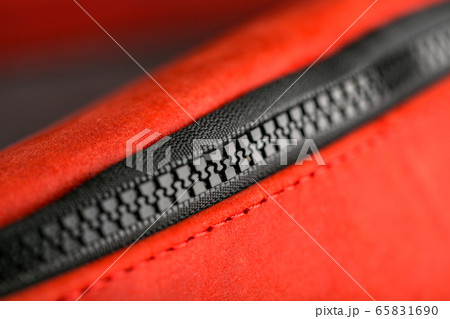 Zipper slider for a red suede leather bag. Zipper slider for a red suede leather bag. 65831690