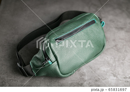 Belt bag made of dark green textured leather, 65831697
