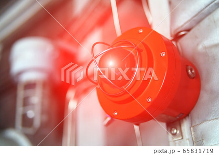 Fire alarm with red warning light of an emergency 65831719