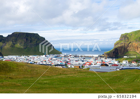 Heimaey town aerial view from Eldfell volcano. Heimaey town aerial view from Eldfell volcano. 65832194