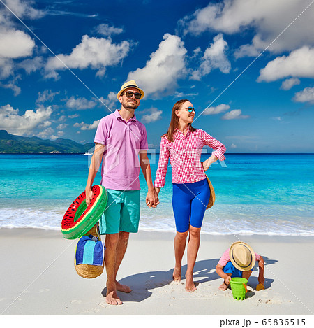 Family with three year old boy on beach. Family with three year old boy on beach. 65836515