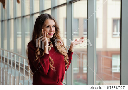 Young businesswoman with mobilephone. Young businesswoman with mobilephone. 65838707