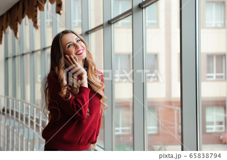 Young businesswoman with mobilephone. Young businesswoman with mobilephone. 65838794