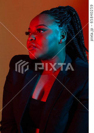 Closeup beauty portrait of young african american girl with afro and glamour makeup. 65840259