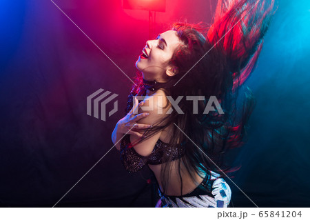 Belly dancer. Young attractive woman dancing tribal fusion on the stage. Oriental exotic dance. 65841204