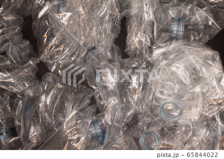 Plastic bottles background. Empty bottles on black 65844022