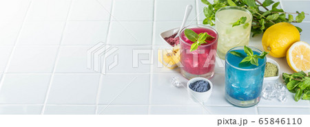 Selection of matcha lemonades - green, blue, red on white background 65846110