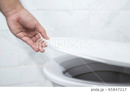 Hand open toilet at home Hand open toilet at home 65847217