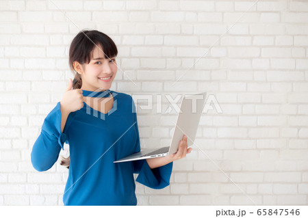 Beautiful freelance young asian woman confident using laptop computer online internet 65847546