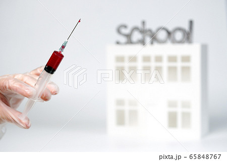 doctor hand in a glove holds a syringe with doctor hand in a glove holds a syringe with 65848767