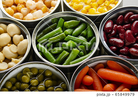 Canned vegetables in opened tin cans on kitchen 65849979
