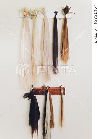 Hair salon, beauty spa. Procedure of hair extensions. 65851807
