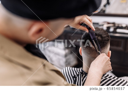 Men's beauty salon. Men's haircut in a barbershop.  65854037