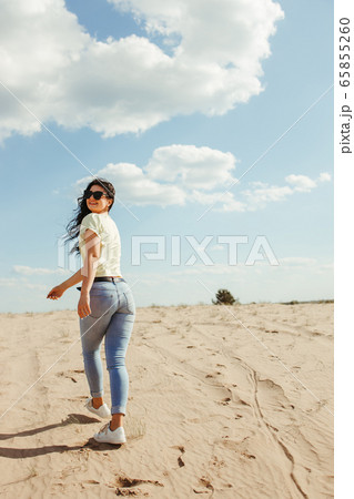 Carefree woman traveler enjoying vacation. 65855260