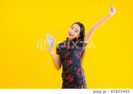 Portrait beautiful young asian woman wear chinese dress with a lot of cash 65855495