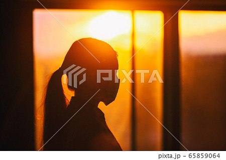 COVID-19 healthcare worker inside hospital wearing mask silhouette woman walking. Concept for anxiety, social distancing impact of coronavirus COVID-19 healthcare worker inside hospital wearing mask silhouette woman walking. Concept for anxiety, social distancing impact of coronavirus 65859064