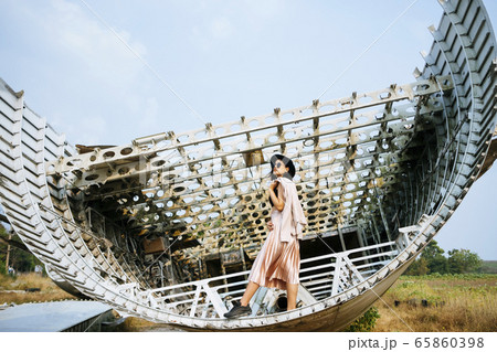 Thai woman on a part of an airplane. Thai woman on a part of an airplane. 65860398
