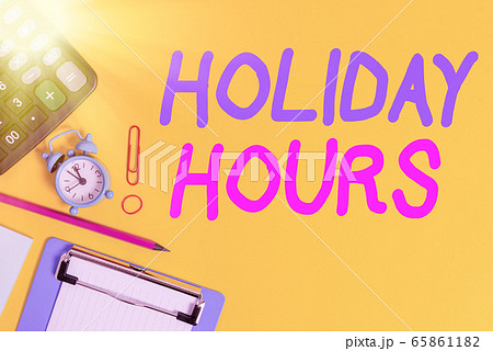 Text sign showing Holiday Hours. Conceptual photo 65861182
